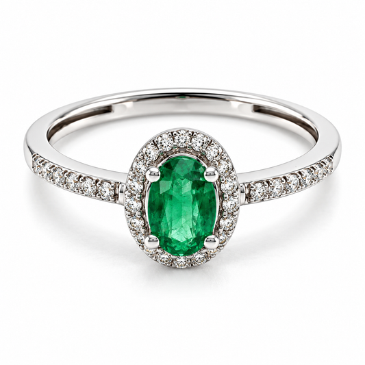Anillo de compromiso en oro blanco con diamantes laterales y una Esmeralda central corte Oval | 14JC252425LQ