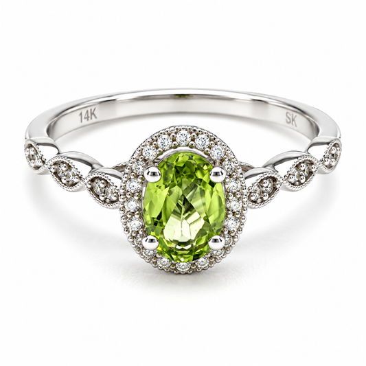 Anillo de compromiso en oro blanco de 14 Kilates, con diamantes laterales y un Peridoto central en corte Oval | 14JC259732LQ