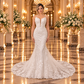 Vestido de novia 51BBFONTANALQ corte sirena en color ivory, vista frontal completa con modelo en lobby de hotel.