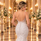 Detalle de espalda del vestido de novia 51BBFONTANALQ en color ivory, con pedrería, botones y encaje floral.
