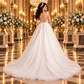 Vista de espalda del vestido de novia 51BDD15LQ ivory, cauda de tul, encaje floral y botonadura central.